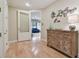 Charming hallway featuring hardwood floors and decorative furniture, leading to another room at 1341 Marinella Dr, Palm Harbor, FL 34684