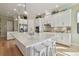 Spacious kitchen boasts large island with seating, stainless steel appliances, and white cabinetry at 1341 Marinella Dr, Palm Harbor, FL 34683