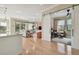 Open-concept living room featuring hardwood floors, sliding barn door, and a view to the outside at 1341 Marinella Dr, Palm Harbor, FL 34683