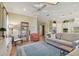This open-concept living room has a ceiling fan, comfortable seating and flows into the kitchen at 1341 Marinella Dr, Palm Harbor, FL 34683