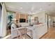 Bright living room features hardwood floors, comfortable seating and a modern media center at 1341 Marinella Dr, Palm Harbor, FL 34683