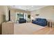 Bright living room with plush seating, large windows, and a view of the backyard at 1341 Marinella Dr, Palm Harbor, FL 34683