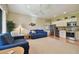 Bright living room connects to modern kitchen, featuring plush seating and an open floor plan at 1341 Marinella Dr, Palm Harbor, FL 34683