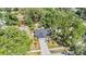 Charming single-Gathering home boasts mature landscaping and a long driveway at 14903 Winterwind Dr, Tampa, FL 33624