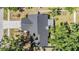 This home features a well-maintained roof and landscaping with privacy fence at 14903 Winterwind Dr, Tampa, FL 33624