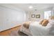 Cozy bedroom featuring a plush bed, closet, neutral tones, and soft lighting for a comfortable retreat at 14903 Winterwind Dr, Tampa, FL 33624