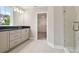 Modern bathroom featuring double sinks and a glass-enclosed shower at 1522 W Arch St, Tampa, FL 33607