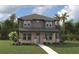 Charming two-story home with a well-manicured lawn and lovely landscaping at 1522 W Arch St, Tampa, FL 33607