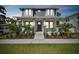 Inviting two-story home with well-maintained landscaping and a cozy front porch at 1522 W Arch St, Tampa, FL 33607