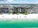 Stunning aerial view of condo complex directly fronting a beautiful white sand beach at 15400 Gulf Blvd # 202, Madeira Beach, FL 33708