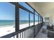 Large balcony overlooking white sandy beach with ocean views at 15400 Gulf Blvd # 202, Madeira Beach, FL 33708