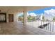 Spacious balcony with metal railing offering views of the neighborhood and parking at 15400 Gulf Blvd # 202, Madeira Beach, FL 33708