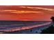 Scenic beach view at sunset with brilliant colors reflecting on the ocean's surface at 15400 Gulf Blvd # 202, Madeira Beach, FL 33708