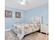 Bright bedroom with nautical decor, plush rug, and a comfortable bed at 15400 Gulf Blvd # 202, Madeira Beach, FL 33708