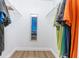 Walk-in closet with hanging clothes and shelves at 15400 Gulf Blvd # 202, Madeira Beach, FL 33708