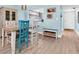 Inviting dining area featuring beach-themed decor and views into the living room and kitchen at 15400 Gulf Blvd # 202, Madeira Beach, FL 33708