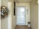 Condo entrance with Welcome sign at 15400 Gulf Blvd # 202, Madeira Beach, FL 33708