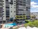 Exterior view of the condo building showcasing a pool and resident balconies at 15400 Gulf Blvd # 202, Madeira Beach, FL 33708