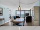 Well-lit living space blending dining and living areas with ocean views through expansive windows at 15400 Gulf Blvd # 202, Madeira Beach, FL 33708