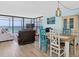 Inviting living space showcasing ocean views, wood-look floors, and stylish furnishings at 15400 Gulf Blvd # 202, Madeira Beach, FL 33708