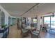 Recreation room with tables, chairs, and views of the gulf and pool at 15400 Gulf Blvd # 202, Madeira Beach, FL 33708