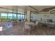 Recreation room with tables, chairs, and a spectacular view of the gulf at 15400 Gulf Blvd # 202, Madeira Beach, FL 33708