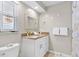 Bathroom featuring neutral paint, granite countertops, and tiled floors at 1560 Simmons Dr, Clearwater, FL 33756