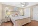 Bedroom with wood floors, ceiling fan, and nautical decor at 1560 Simmons Dr, Clearwater, FL 33756