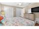 Bedroom with wood floors and large dresser at 1560 Simmons Dr, Clearwater, FL 33756