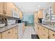 Spacious kitchen featuring modern appliances, ample counter space, and tile flooring at 1560 Simmons Dr, Clearwater, FL 33756