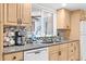 Bright kitchen featuring modern appliances, granite countertops, and ample cabinet space at 1560 Simmons Dr, Clearwater, FL 33756