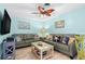 Relaxing living room with comfortable seating, coastal decor, and plenty of natural light at 1560 Simmons Dr, Clearwater, FL 33756