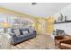 Inviting living room with a large window, fireplace, and comfortable furniture at 1560 Simmons Dr, Clearwater, FL 33756
