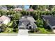 Beautiful home with manicured lawn, mature landscaping and a paver driveway at 15625 Hawks Crest Loop, Odessa, FL 33556