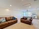 Upstairs living room featuring comfortable seating, ceiling fan, and lots of sunlight at 15625 Hawks Crest Loop, Odessa, FL 33556