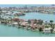 Waterfront home with private dock, swimming pool, and tropical landscaping at 16353 Redington Dr, Redington Beach, FL 33708