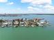 Waterfront homes featuring boat docks on an island at 16353 Redington Dr, Redington Beach, FL 33708