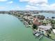 Waterfront homes featuring docks on a peninsula with coastal views at 16353 Redington Dr, Redington Beach, FL 33708