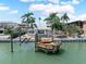 Stunning waterfront property featuring a private dock, offering serene water views and easy access for boating at 16353 Redington Dr, Redington Beach, FL 33708