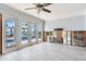 Living room with multiple glass doors to the backyard showcasing a pool and beautiful water views at 16353 Redington Dr, Redington Beach, FL 33708