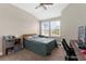 Cozy bedroom with bright windows and carpeted flooring, featuring a ceiling fan at 1969 Milkweed Trce, Lutz, FL 33558