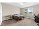 Neutral bedroom featuring a double window, neutral walls, and carpeted flooring at 1969 Milkweed Trce, Lutz, FL 33558