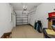 Spacious garage with ample storage, a secure door, and room for vehicles and equipment at 1969 Milkweed Trce, Lutz, FL 33558