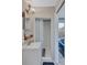 This bathroom features a sink, shower, and a mirror at 1984 Trotter Rd, Largo, FL 33774