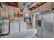 This garage features a water heater, washer and dryer, and stainless steel refrigerator at 1984 Trotter Rd, Largo, FL 33774