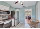 Stainless steel appliances in this kitchen leads to a dining area at 1984 Trotter Rd, Largo, FL 33774