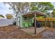 Cozy shed with small porch area and chairs perfect for relaxing outdoors at 1984 Trotter Rd, Largo, FL 33774
