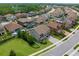 Aerial view of a neighborhood featuring beautiful houses and mature trees at 21878 Amelia Rose Way, Land O Lakes, FL 34637