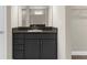 Bathroom vanity with dark cabinetry, granite countertop and sink in neutral toned modern bath at 21878 Amelia Rose Way, Land O Lakes, FL 34637