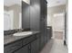 Modern bathroom with dual vanities and ample cabinet space in a neutral color palette at 21878 Amelia Rose Way, Land O Lakes, FL 34637